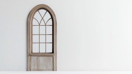 A vintage arched window frame against a minimalist white wall.