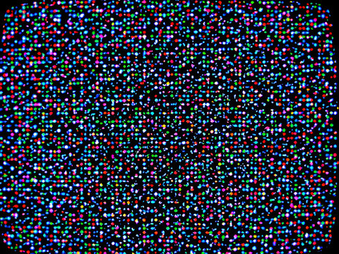 Close-up of colorful pixels on a digital screen, abstract technological background.