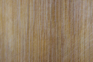 Brown scratched wooden cutting board. Wood texture