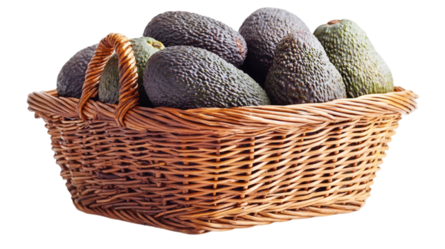 Isolated of a collection of avocados neatly arranged in a wicker basket on a solid white background Stock Photo with side copy space