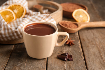 Cup of hot chocolate on wooden background