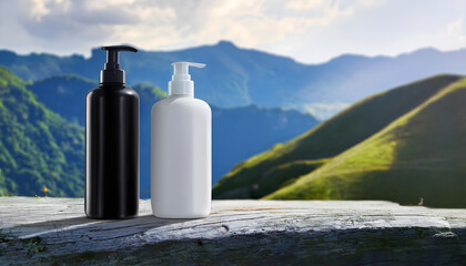 Minimalist black and white pump bottles in a natural landscape