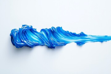 Vivid blue toothpaste swirls across a white surface creating texture