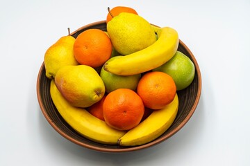 Mix fresh fruits in the bowl isolated on white background