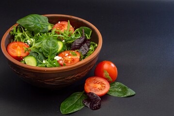 Fresh salad with tomatoes, basil, lettuce and olive oil. healthy food.