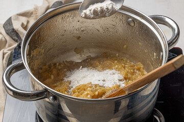 Adding flour to caramelized onions