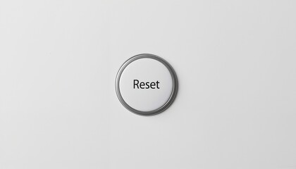 Fototapeta premium Round reset button with a sleek silver border and bold black text on a minimalist background