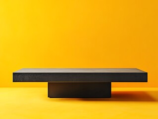 Modern Minimalist Table Design With a Black Surface Against a Vibrant Yellow Background in a Contemporary Setting