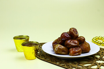 Sukkari Dates Fruits on isolated background. Breakfasting concept in Ramadan month. Islamic template for text background. 
