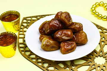 Sukkari Dates Fruits on isolated background. Breakfasting concept in Ramadan month. Islamic template for text background. 
