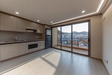 Obraz premium Modern apartment kitchen with panoramic city view from balcony.