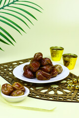 Sukkari Dates Fruits on isolated background. Breakfasting concept in Ramadan month. Islamic template for text background. 
