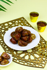 Sukkari Dates Fruits on isolated background. Breakfasting concept in Ramadan month. Islamic template for text background. 
