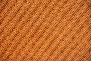 Texture of handmade knitting of natural yarn. Sheep common wool. Knitted background. Closeup