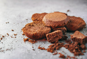 Close-up of coffee grounds from espresso machine. coffee ground on gray background