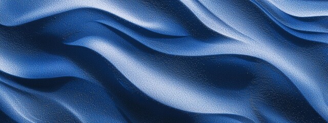 Fototapeta premium Dusty blue sand dunes with intricate windblown patterns in natural setting