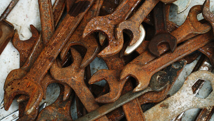 Pile of rusted wrenches