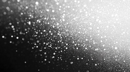 A grainy gradient background featuring grey, black, and white monochrome tones creates a smooth yet chaotic noise texture, offering a sense of modernity, depth, and visual intensity in design


