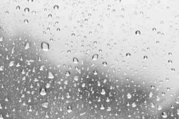 PNG Raindrops on glass surface background droplets texture.