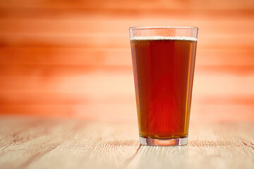 A photo of a beer in a glass on a table