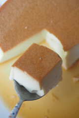  Caramel custard pudding on a plate on table 