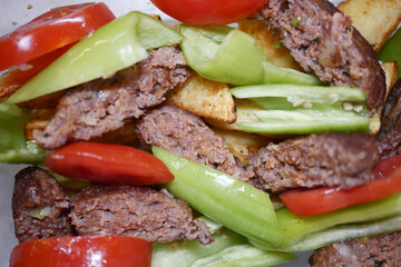 Delicious Grilled Kebab with Fresh Vegetables and Crisp Slices of Tomatoes