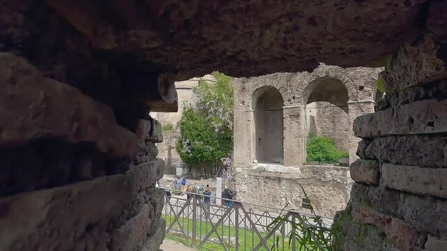 Panoramic shot of Roman Forum with tourist people sightseeing old ancient buildings