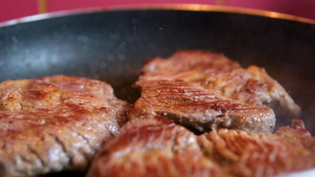 Sizzling Steak Being Lifted off of a Grill. High quality 4k footage