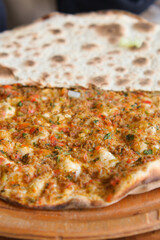 Delicious Turkish Pide with Fresh Ingredients on Wooden Plate