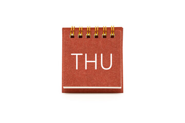 THU text on red desk calendar with clipping path isolated on white background. THURSDAY and Calendar concept.