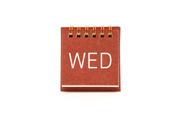 WED text on red desk calendar with clipping path isolated on white background. WEDNESDAY and Calendar concept.
