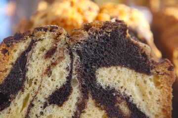 Indulge in a Delicious Chocolate Marble Cake Slice adorned with Creamy Swirls