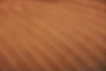 Abstract blurred, gradient background transitioning from a light beige to a darker, orange-brown, noise effect