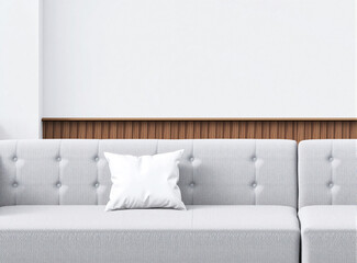 Naklejka premium A clean, modern living room featuring a neutral-colored sofa with a centered blank pillow, perfect for mockups.