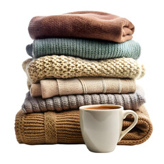 Mug  with stack of warm clothes on white-background