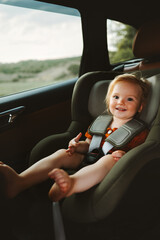 Kid girl passenger in a car safety seat family lifestyle baby security transportation child in a...