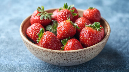 Fresh red strawberries in a bowl, highlighting their vibrant color and fresh texture.