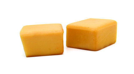 Cubes of cheddar cheese isolated on white