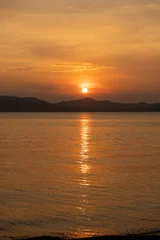 Fototapete sunset over the sea © Julie