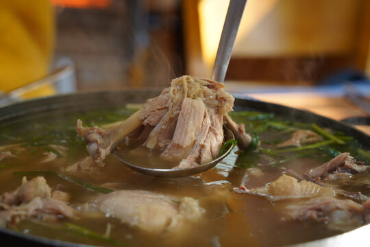Korean food made by boiling whole chicken with garlic and seasoning it with salt