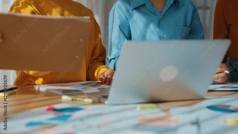 Poster startup company employee working together using laptop analyzing bi dashboard paper on financial dat