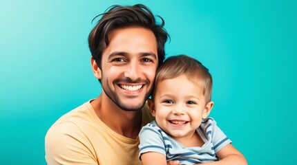 Joyful father and son smiling enthusiastically against a bright blue background