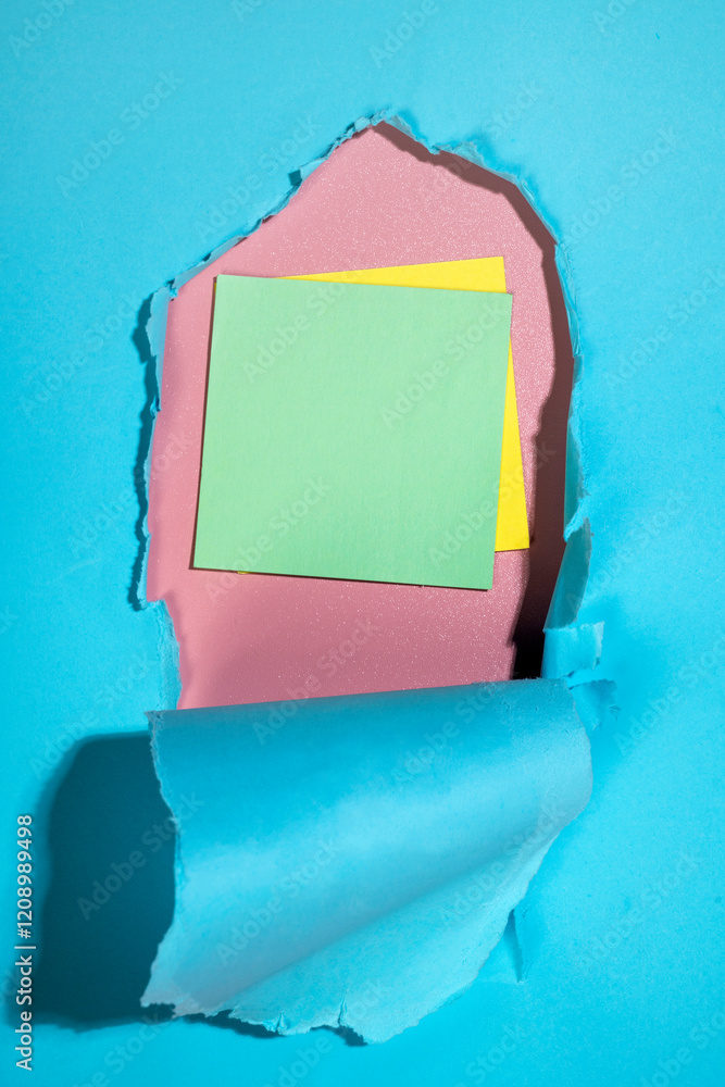 Aufkleber empty notepaper on the hole of ripped paper. mockup or copy space. template. presentation or adverti