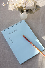 A to-do list on a blank sheet of paper.
Vertical photo.