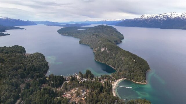 Serene aerial drone footage gliding over the lush forests and tranquil beauty of Parque Nacional Arrayanes, capturing stunning natural landscapes in Patagonia, Argentina.