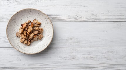Sliced chanterelle mushrooms served on a rustic plate against a light wooden background for culinary design and food presentation concepts