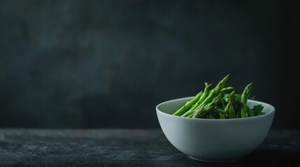 Fresh Green Asparagus Displayed in a White Bowl on a Dark Textured Surface with Ample Copy Space for Text