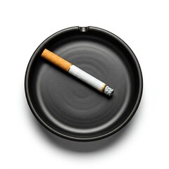 black ceramic ashtray with a cigarette on white background
