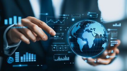 Global Network in Hand: A businessman interacts with a holographic globe and data visualizations, symbolizing global connectivity, data analysis, and technological advancement.