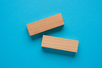 Blank wooden blocks on a blue background that can be written on